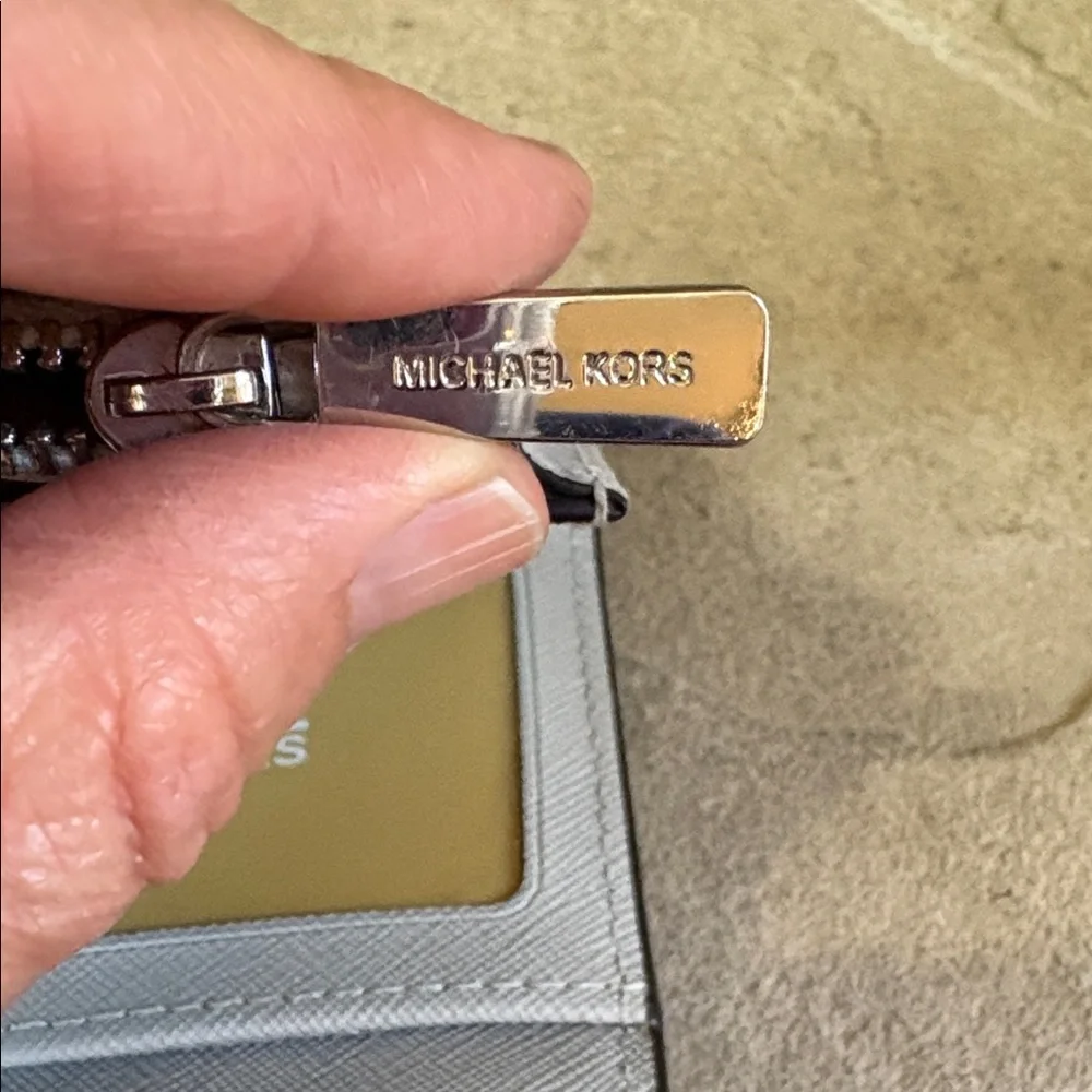 Michael Kors light grey wristlet/wallet